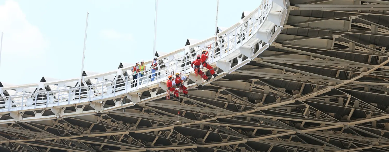 MMPP technicians installing lighting on a stadium roof structure